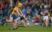 9 March 2014; Tomás Hamill, Tipperary, is dispossessed by Colm Galvin, Clare, in the lead up to Clare's second goal of the game. Allianz Hurling League, Division 1A, Round 3, Tipperary v Clare, Semple Stadium, Thurles, Co. Tipperary. Picture credit: Brendan Moran / SPORTSFILE