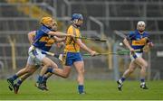 9 March 2014; John Conlon, Clare, in action against Shane McGrath and Kieran Bergin, Tipperary. Allianz Hurling League, Division 1A, Round 3, Tipperary v Clare, Semple Stadium, Thurles, Co. Tipperary. Picture credit: Brendan Moran / SPORTSFILE