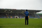 9 March 2014; Tipperary manager Peter Creedon stands in the rain watching the game. Allianz Football League, Division 4, Round 4, Tipperary v Clare, Semple Stadium, Thurles, Co. Tipperary. Picture credit: Brendan Moran / SPORTSFILE