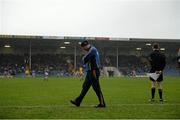 9 March 2014; Tipperary manager Peter Creedon walks the sideline during the game in heavy rain. Allianz Football League, Division 4, Round 4, Tipperary v Clare, Semple Stadium, Thurles, Co. Tipperary. Picture credit: Brendan Moran / SPORTSFILE