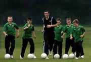 31 August 2005; Shelbourne striker Jason Byrne with Clonmel Town U12 players, from left, Ian Fahy, Michael Quinlivan, Padraig Quinlivan, Seamus Kennedy and Coman Kennedy, as the Clonmel Town U12 team take a final training session before they depart to represent Ireland at the World Finals of the Danone Nations Cup at the Gerland Stadium in Lyon, home to Olympic Lyonais. AUL Complex, Clonshaugh, Dublin. Picture credit; David Maher / SPORTSFILE