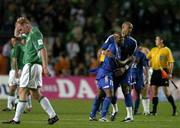 7 September 2005; French players Sylvain WIltord (11) and Jean Alain Boumsong celebrate as Gary Doherty, Republic of Ireland, leaves the field. Republic of Ireland. FIFA 2006 World Cup Qualifier, Group 4, Republic of Ireland v France, Lansdowne Road, Dublin. Picture credit; Brendan Moran / SPORTSFILE