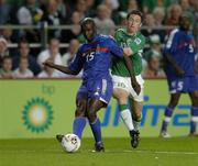 7 September 2005; Lilian Thuram, France, in action against Robbie Keane, Republic of Ireland. FIFA 2006 World Cup Qualifier, Group 4, Republic of Ireland v France, Lansdowne Road, Dublin. Picture credit; Brian Lawless / SPORTSFILE