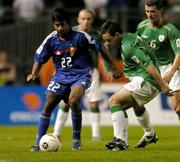 7 September 2005; Vikash Dhorasoo, France, in action against Andy Reid and Roy Keane, Republic of Ireland. FIFA 2006 World Cup Qualifier, Group 4, Republic of Ireland v France, Lansdowne Road, Dublin. Picture credit; David Maher / SPORTSFILE