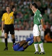7 September 2005; Roy Keane, Republic of Ireland, reacts to the whistle of referee Herbert Fandel as Claude Makelele, France, lies injured. FIFA 2006 World Cup Qualifier, Group 4, Republic of Ireland v France, Lansdowne Road, Dublin. Picture credit; Brendan Moran / SPORTSFILE