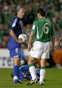 7 September 2005; Zinedine Zidane, France, has words with Roy Keane, Republic of Ireland, after Keane fouled Claude Makelele and was subsequently shown a yellow card by referee Herbert Fandel. FIFA 2006 World Cup Qualifier, Group 4, Republic of Ireland v France, Lansdowne Road, Dublin. Picture credit; Brendan Moran / SPORTSFILE