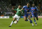 7 September 2005; Stephen Carr, Republic of Ireland, in action against Jean Alain Boumsong (2) and William Gallas (5), France. FIFA 2006 World Cup Qualifier, Group 4, Republic of Ireland v France, Lansdowne Road, Dublin. Picture credit; Brendan Moran / SPORTSFILE