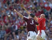 11 September 2005; Brian Corcoran, Cork, in action against Tony Og Regan, Galway. Guinness All-Ireland Senior Hurling Championship Final, Galway v Cork, Croke Park, Dublin. Picture credit; Ray McManus / SPORTSFILE *** Local Caption *** Any photograph taken by SPORTSFILE during, or in connection with, the 2005 Guinness All-Ireland Hurling Final which displays GAA logos or contains an image or part of an image of any GAA intellectual property, or, which contains images of a GAA player/players in their playing uniforms, may only be used for editorial and non-advertising purposes.  Use of photographs for advertising, as posters or for purchase separately is strictly prohibited unless prior written approval has been obtained from the Gaelic Athletic Association.