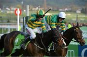 11 March 2014; Jezki, with Barry Geraghty up, left, races My Tent or Yours, with Tony McCoy up, who finished second, on their way to winning the Stan James Champion Hurdle Challenge Trophy. Cheltenham Racing Festival 2014. Prestbury Park, Cheltenham, England. Picture credit: Ramsey Cardy / SPORTSFILE