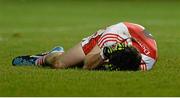 12 March 2014; Declan Brown, Derry, holds his head after receiving an early injury to the neck, with led to him leaving the field. Cadbury Ulster GAA Football U21 Championship, Preliminary Round, Derry v Cavan, Celtic Park , Derry. Picture credit: Oliver McVeigh / SPORTSFILE