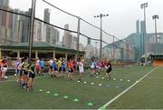 13 March 2014; The TG4 Ladies Allstar coach William O'Sullivan, Kerry, explains drills to the players during the squad training session at the Hong Kong Football Club. 2014 TG4 Ladies Football All-Star Tour, Hong Kong, China. Picture credit: Brendan Moran / SPORTSFILE