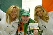 7 September 2005; Ireland fan Jim Kinsella, Enniscorthy, Co. Wexford with models Jenny O'Duffy, left, and Joanne Dever, was celebrating after winning tickets to the big match from www.carlsbergmoments.ie, a website created by Carlsberg for fans to vote for their favourite World Cup moment -  Jim voted for McAteers goal against the Dutch in the 2002 qualifiers. Ray Houghton's goal against Italy in USA '94 is currently leading the poll. Berkeley Court Hotel, Dublin. Picture credit; Brendan Moran / SPORTSFILE