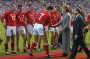 11 September 2005; Cork captain Sean Og O hAilpin greets President Mary McAleese in the presence of GAA President Sean Kelly. Guinness All-Ireland Senior Hurling Championship Final, Galway v Cork, Croke Park, Dublin. Picture credit; Brendan Moran / SPORTSFILE *** Local Caption *** Any photograph taken by SPORTSFILE during, or in connection with, the 2005 Guinness All-Ireland Hurling Final which displays GAA logos or contains an image or part of an image of any GAA intellectual property, or, which contains images of a GAA player/players in their playing uniforms, may only be used for editorial and non-advertising purposes.  Use of photographs for advertising, as posters or for purchase separately is strictly prohibited unless prior written approval has been obtained from the Gaelic Athletic Association.