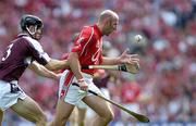 11 September 2005; Brian Corcoran, Cork, in action against Tony Og Regan, Galway. Guinness All-Ireland Senior Hurling Championship Final, Galway v Cork, Croke Park, Dublin. Picture credit; Brendan Moran / SPORTSFILE *** Local Caption *** Any photograph taken by SPORTSFILE during, or in connection with, the 2005 Guinness All-Ireland Hurling Final which displays GAA logos or contains an image or part of an image of any GAA intellectual property, or, which contains images of a GAA player/players in their playing uniforms, may only be used for editorial and non-advertising purposes.  Use of photographs for advertising, as posters or for purchase separately is strictly prohibited unless prior written approval has been obtained from the Gaelic Athletic Association.