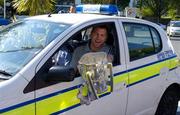 12 September 2005; Cork hurler Diarmuid O'Sullivan sits in a garda car with the Liam MacCarthy cup, prior to the victorious Cork team's departure to Cork for their homecoming. Burlington Hotel, Dublin. Picture credit; Pat Murphy / SPORTSFILE