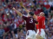 11 September 2005; Tony Og Regan, Galway, in action against Brian Corcoran, Cork. Guinness All-Ireland Senior Hurling Championship Final, Galway v Cork, Croke Park, Dublin. Picture credit; Ray McManus / SPORTSFILE *** Local Caption *** Any photograph taken by SPORTSFILE during, or in connection with, the 2005 Guinness All-Ireland Hurling Final which displays GAA logos or contains an image or part of an image of any GAA intellectual property, or, which contains images of a GAA player/players in their playing uniforms, may only be used for editorial and non-advertising purposes.  Use of photographs for advertising, as posters or for purchase separately is strictly prohibited unless prior written approval has been obtained from the Gaelic Athletic Association.