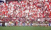 21 September 1986; The Kerry and Tyrone teams march in front of Tyrone fans in Hill 16 during the pre-match parade ahead of the All-Ireland Senior Football Championship final between Kerry and Tyrone in Croke Park, Dublin. Photo by Ray McManus/Sportsfile