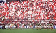 21 September 1986; The Kerry and Tyrone teams march in front of Tyrone fans in Hill 16 during the pre-match parade. Kerry v Tyrone, All-Ireland Football Final, Croke Park, Dublin. Picture credit; Ray McManus / SPORTSFILE