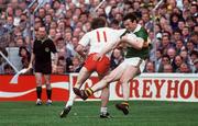 21 September 1986; Tommy Doyle, Kerry, is tackled by Eugene McKenna, Tyrone. Kerry v Tyrone, All-Ireland Football Final, Croke Park, Dublin. Picture credit; Ray McManus / SPORTSFILE
