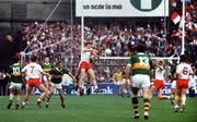 21 September 1986; Jack O'Shea, Kerry, contests a high ball with Harry McClure, Tyrone, as Willie Maher (10), Kerry, Paddy Ball (7), Tyrone, Ambrose O'Donovan, Kerry, John Lynch (4) and Noel McGinn (6), both Tyrone, await the break. Kerry v Tyrone, All-Ireland Football Final, Croke Park, Dublin. Picture credit; Ray McManus / SPORTSFILE