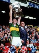 22 September 1985; Kerry captain Paidi O Se lifts the Sam Maguire in the company of Dr Mick Loftus, President of the GAA. Kerry v Dublin, All-Ireland Football Final, Croke Park, Dublin. Picture credit; Ray McManus / SPORTSFILE
