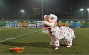 14 March 2014; A traditional Chinese Lion Dance is performed during half-time of the Exhibition match as the teams look on. 2014 TG4 Ladies Football All-Star Tour, 2012 Allstars v 2013 Allstars Exhibition match, Hong Kong Football Club, Hong Kong, China. Picture credit: Brendan Moran / SPORTSFILE