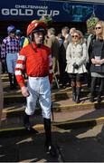 14 March 2014; Jockey Ruby Walsh walks out ahead of the JCB Triumph Hurdle prior to sustaining a compound fracture of the humerous at the second fence. Cheltenham Racing Festival 2014, Prestbury Park, Cheltenham, England. Picture credit: Ramsey Cardy / SPORTSFILE