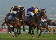 14 March 2014; Lord Windermere, right, with Davy Russell up, races On His Own, with David Casey up, who finished second, on their way to winning the BetFred Cheltenham Gold Cup Chase. Cheltenham Racing Festival 2014, Prestbury Park, Cheltenham, England. Picture credit: Ramsey Cardy / SPORTSFILE