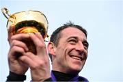 14 March 2014; Winning jockey Davy Russell celebrates with the Gold Cup after winning the BetFred Cheltenham Gold Cup Chase on Lord Windermere. Cheltenham Racing Festival 2014, Prestbury Park, Cheltenham, England. Picture credit: Barry Cregg / SPORTSFILE