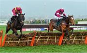 14 March 2014; Don Poli, right, with Michael Fogarty up, jumps the last ahead of Thomas Crapper, with Joseph Palmowski up, on their way to winning the Martin Pipe Conditional Jockeys' Handicap Hurdle. Cheltenham Racing Festival 2014, Prestbury Park, Cheltenham, England. Picture credit: Barry Cregg / SPORTSFILE