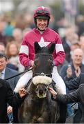 14 March 2014; Jockey Davy Russell celebrates on Savello after winning the Johnny Henderson Grand Annual Steeple Chase Challenge Cup. Cheltenham Racing Festival 2014, Prestbury Park, Cheltenham, England. Picture credit: Barry Cregg / SPORTSFILE