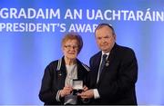 14 March 2014; Mary Wheatley, Crettyard, Laois, is presented with her GAA President's Awards for 2014 Ladies Football award by Uachtarán Chumann Lúthchleas Gael Liam Ó Néill. Mary Wheatley's involvement in Ladies Football stretches across every level of the Association starting as it did with her club Crettyard before advancing to occupy the highest position as overall Association President between 1988 and 1991. Mary has also been heavily involved at Provincial level occupying a number of key roles. She is a current member of the Management Committee of the Ladies Gaelic Football Association. Picture credit: Pat Murphy / SPORTSFILE