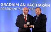 14 March 2014; Paddy Burke, Tír Conaill Gaels, London, is presented with his GAA President's Awards for 2014 International award by Uachtarán Chumann Lúthchleas Gael Liam Ó Néill. A Donegal native, Paddy Burke has had a long and illustrious involvement with the GAA in London but most notably Tír Chonaill Gaels. Having served the club as a player and manager - with no little success - he brought his influence to bear on two key projects, namely the formation of an underage section and the acquisition of a permanent home for the club. Picture credit: Pat Murphy / SPORTSFILE