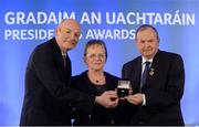 14 March 2014; Máire Ní Cheallaigh, Raheny, Dublin, is presented with her GAA President's Awards for 2014 award by Uachtarán Chumann Lúthchleas Gael Liam Ó Néill and Denis O’Callaghan, AIB, Head of Branch Banking, left. Máire was born into a dedicated GAA family – her father won an All-Ireland media in 1953 with Kerry and after playing camogie with UCD she was elected as Cathaoirleach of the club. She has also served on the Comhairle Committee liaising with clubs and currently is the Camogie representative on the national Féile Committee, Cathaoirleach of the Volunteer Committee and Cathaoirleach of the Leinster Coiste Cultúr agus Gaeilge. Picture credit: Pat Murphy / SPORTSFILE
