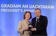 14 March 2014; Maureen Kincaid, Shamrocks, Offaly, is presented with her GAA President's Awards for 2014 award by Uachtarán Chumann Lúthchleas Gael Liam Ó Néill. Maureen Kincaid first developed an interest in the GAA through involvement in camogie while in school in Ballymahon before going onto win county junior medals with Milltown and representing Westmeath. A successful move into coaching and administration followed and she has served as Secretary of Shamrocks and County Development Officer. She continues to assist on match days at O’Connor Park. Picture credit: Pat Murphy / SPORTSFILE