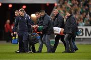 15 March 2014; Ireland's Jonathan Sexton is carried from the field in a head brace following a collision with France's Mathieu Bastareaud during the second half. RBS Six Nations Rugby Championship 2014, France v Ireland, Stade De France, Saint Denis, Paris, France. Picture credit: Stephen McCarthy / SPORTSFILE