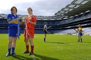 13 September 2005; Senior captains Deirdre Hughes, Tipperary, left, and Elaine Burke, Cork, with the O'Duffy Cup, while Junior captains Eimear Brannigan, Dublin, and Deirdre Murphy, Clare, practice their skills at a Captains Day in advance of the Foras na Gaeilge All-Ireland Senior and Junior Camogie Championship Finals to be played on September 18th. Croke Park, Dublin. Picture credit; Pat Murphy / SPORTSFILE