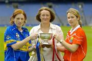13 September 2005; Senior captains Deirdre Hughes, Tipperary, left, and Cork's Elaine Burke, with Miriam O'Callaghan, President of the Camogie Association, at a Captains Day in advance of the Foras na Gaeilge All-Ireland Senior and Junior Camogie Championship Finals to be played on September 18th. Croke Park, Dublin. Picture credit; Pat Murphy / SPORTSFILE