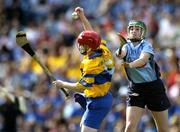 18 September 2005; Cathy Halley, Clare, in action against Gillian McCluskey, Dublin. Dublin v Clare, All-Ireland Junior Camogie Final, Croke Park, Dublin. Picture credit; Brendan Moran / SPORTSFILE *** Local Caption *** Any photograph taken by SPORTSFILE during, or in connection with, the 2005 Guinness All-Ireland Hurling Final which displays GAA logos or contains an image or part of an image of any GAA intellectual property, or, which contains images of a GAA player/players in their playing uniforms, may only be used for editorial and non-advertising purposes.  Use of photographs for advertising, as posters or for purchase separately is strictly prohibited unless prior written approval has been obtained from the Gaelic Athletic Association.