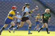 18 September 2005; Louise O'Hara, Dublin, is tackled by Cathy Halley, Clare. Dublin v Clare, All-Ireland Junior Camogie Final, Croke Park, Dublin. Picture credit; Brendan Moran / SPORTSFILE *** Local Caption *** Any photograph taken by SPORTSFILE during, or in connection with, the 2005 Guinness All-Ireland Hurling Final which displays GAA logos or contains an image or part of an image of any GAA intellectual property, or, which contains images of a GAA player/players in their playing uniforms, may only be used for editorial and non-advertising purposes.  Use of photographs for advertising, as posters or for purchase separately is strictly prohibited unless prior written approval has been obtained from the Gaelic Athletic Association.