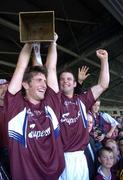 18 September 2005; Galway captain Kenneth Burke, left, lifts the Cashel Cross Trophy with team-mate David Collins, after victory over Kilkenny. Erin All-Ireland U21 Hurling Final, Galway v Kilkenny, Gaelic Grounds, Limerick. Picture credit; Damien Eagers / SPORTSFILE