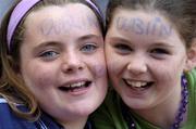 18 September 2005; Dublin fans Amy Galligan, aged 10, with Erica Donnelly, aged 10, right, both from Swords, show their support. Dublin v Clare, All-Ireland Junior Camogie Final, Croke Park, Dublin. Picture credit; Brian Lawless / SPORTSFILE *** Local Caption *** Any photograph taken by SPORTSFILE during, or in connection with, the 2005 Guinness All-Ireland Hurling Final which displays GAA logos or contains an image or part of an image of any GAA intellectual property, or, which contains images of a GAA player/players in their playing uniforms, may only be used for editorial and non-advertising purposes.  Use of photographs for advertising, as posters or for purchase separately is strictly prohibited unless prior written approval has been obtained from the Gaelic Athletic Association.