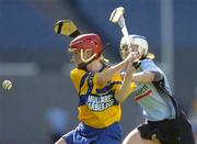 18 September 2005; Deirdre Murphy, Clare, in action against Aine Fanning, Dublin. Dublin v Clare, All-Ireland Junior Camogie Final, Croke Park, Dublin. Picture credit; Brendan Moran / SPORTSFILE *** Local Caption *** Any photograph taken by SPORTSFILE during, or in connection with, the 2005 Guinness All-Ireland Hurling Final which displays GAA logos or contains an image or part of an image of any GAA intellectual property, or, which contains images of a GAA player/players in their playing uniforms, may only be used for editorial and non-advertising purposes.  Use of photographs for advertising, as posters or for purchase separately is strictly prohibited unless prior written approval has been obtained from the Gaelic Athletic Association.