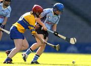 18 September 2005; Eve Talbot, Dublin, in action against Deirdre Corcoran, Clare. Dublin v Clare, All-Ireland Junior Camogie Final, Croke Park, Dublin. Picture credit; Brendan Moran / SPORTSFILE *** Local Caption *** Any photograph taken by SPORTSFILE during, or in connection with, the 2005 Guinness All-Ireland Hurling Final which displays GAA logos or contains an image or part of an image of any GAA intellectual property, or, which contains images of a GAA player/players in their playing uniforms, may only be used for editorial and non-advertising purposes.  Use of photographs for advertising, as posters or for purchase separately is strictly prohibited unless prior written approval has been obtained from the Gaelic Athletic Association.