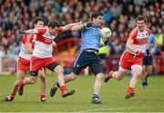 16 March 2014; Michael Darragh Macauley, Dublin, in action against Benny Heron and Mark Lynch, Derry. Allianz Football League, Division 1, Round 5, Derry v Dublin, Celtic Park, Derry. Picture credit: Oliver McVeigh / SPORTSFILE