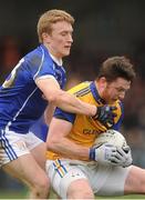 16 March 2014: Michael Quinn, Longford, in action against Turloc Mooney, Cavan. Allianz Football League Division 3, Round 5, Longford v Cavan, Pearse Park, Longford. Picture credit: Ray Lohan / SPORTSFILE