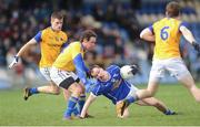 16 March 2014: Paul McKeown, left, and Enda Williams, Longford, in action against Martin Reilly, Cavan. Allianz Football League Division 3, Round 5, Longford v Cavan, Pearse Park, Longford. Picture credit: Ray Lohan / SPORTSFILE