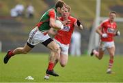 16 March 2014; Jason Gibbons, Mayo, in action against Andrew O'Sullivan, Cork. Allianz Football League, Division 1, Round 5, Mayo v Cork, Elverys MacHale Park, Castlebar, Co. Mayo. Picture credit: David Maher / SPORTSFILE