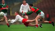9 May 1999; Aidan Quinn of Tyrone in action against Kieran Lally of Mayo during the All-Ireland Vocational Schools' Intercounty Football Final match between Mayo and Tyrone at Páirc U’ Chaoimh in Cork. Photo by Ray McManus/Sportsfile