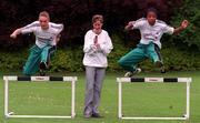 11 May 1999; Catherina McKiernan, centre, pictured alongside Paul Howard, aged 16, from Cabinteely, Dublin, and Shireen McDonagh from Balinteer, Dublin, aged 14, at the launch of the Capri-Sun BLOE Athletic Championships at Merrion Square in Dublin. Photo By Brendan Moran/Sportsfile